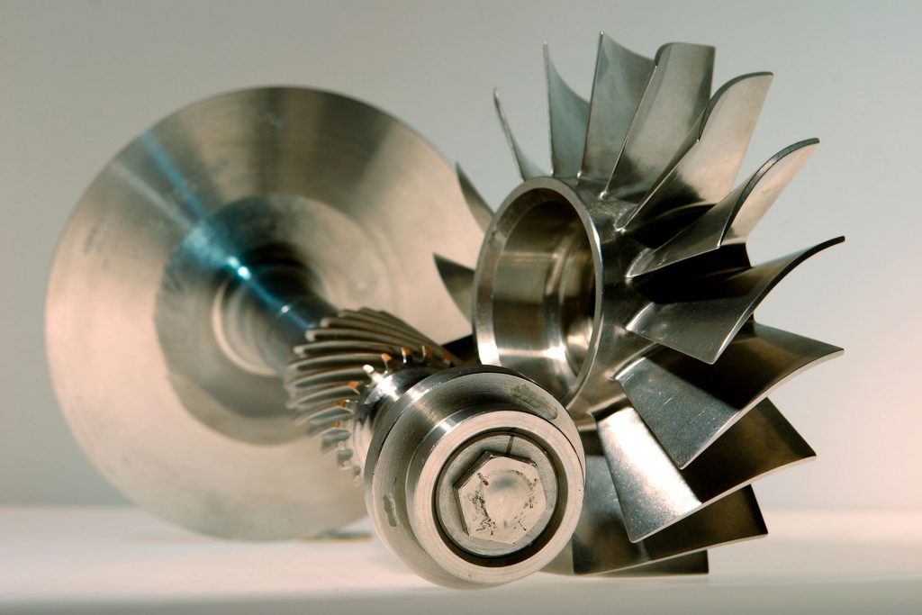 Precision metal turbine impeller gear component.