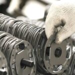 Metal stamping process with coiled metal sheets.