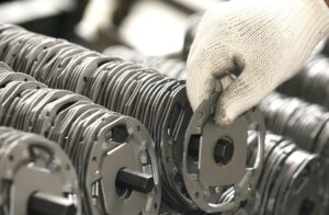 Metal stamping process with coiled metal sheets.