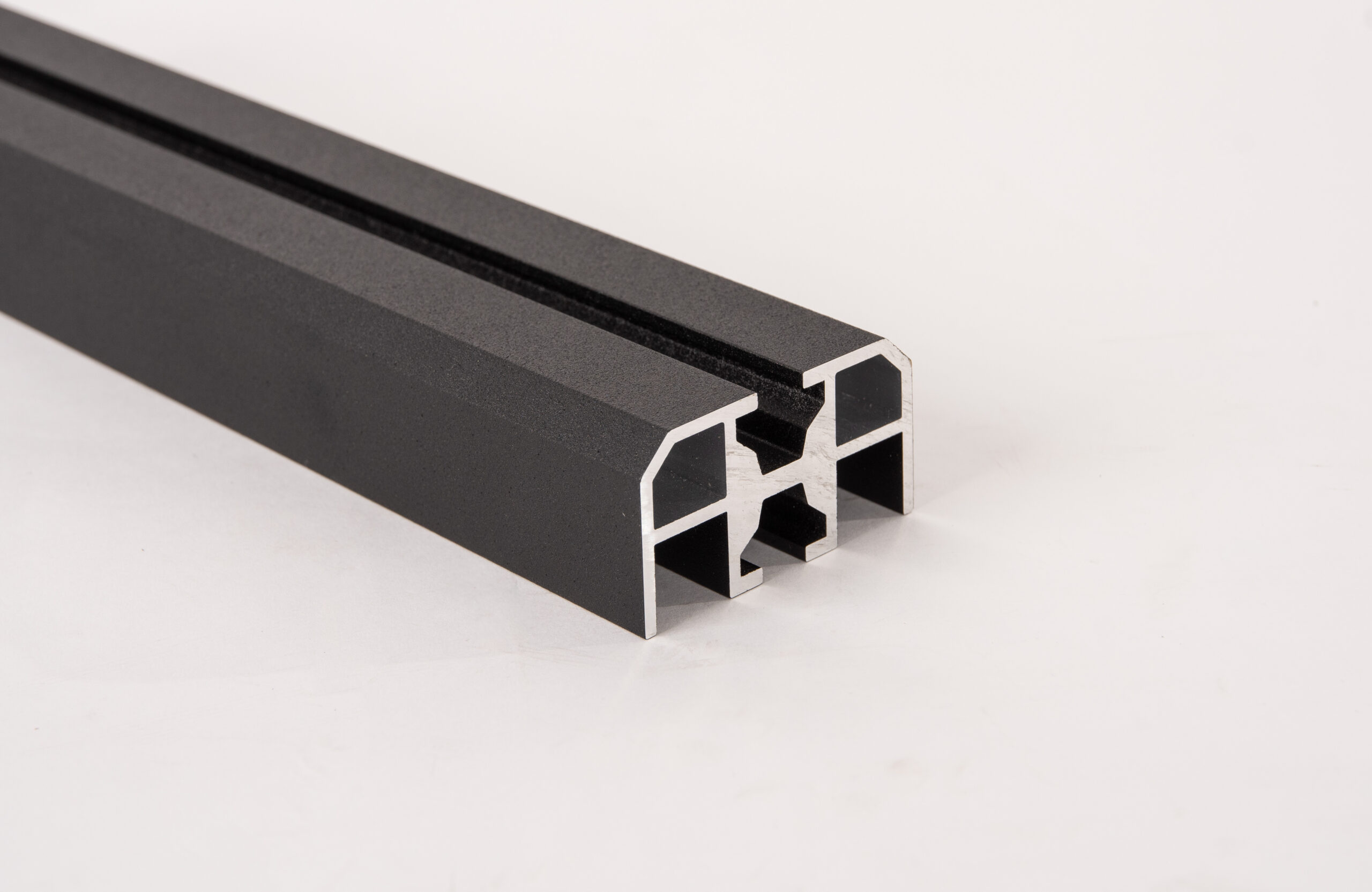 Black anodized T-slot aluminum extrusion profile component.