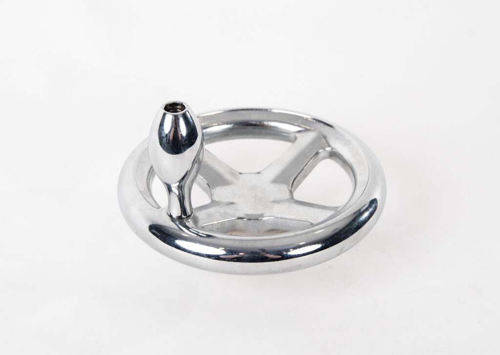 Chrome-plated metal handwheel component with a center mounting hole.